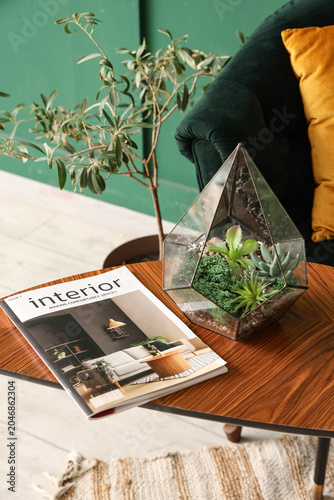 Florarium with magazine on ...