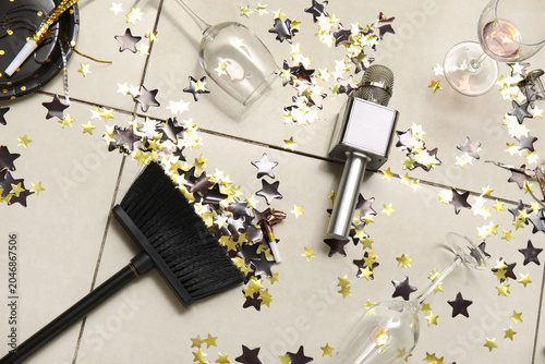 Broom with mess on tile flo...
