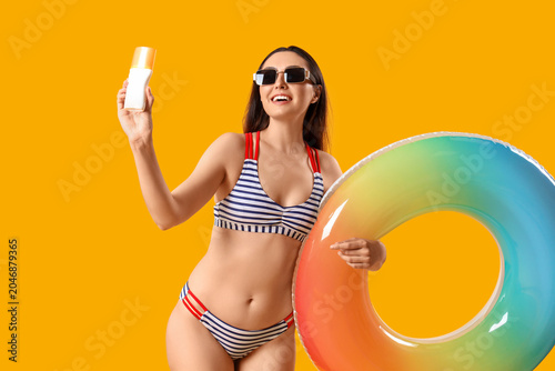 Young woman with sunscreen ...