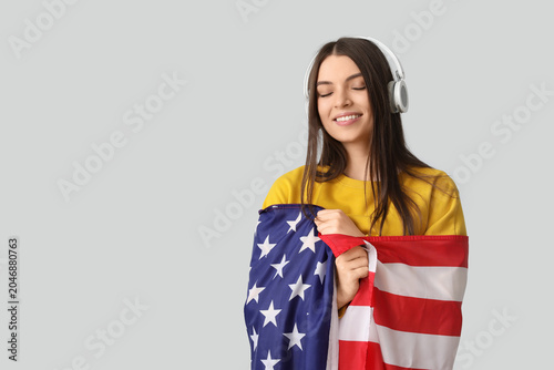 Young woman in headphones w...