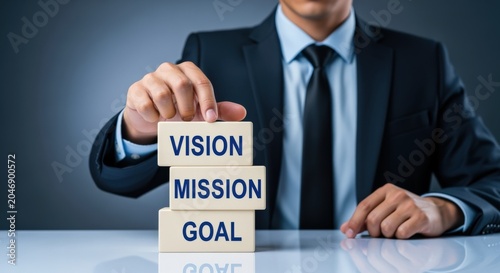 Businessman Stacks Blocks with Vision Mission Goal for Strategic Business Planning and Corporate Objectives