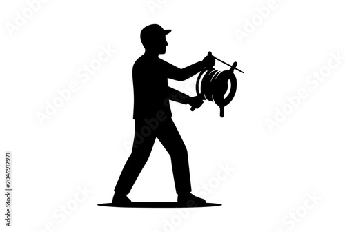 Worker holding a hose reel or cable drum silhouette