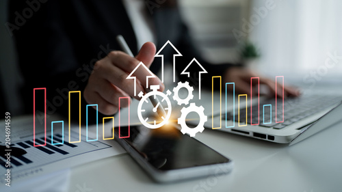 Fotografía This image represents business growth through graphs, gears, and a stopwatch, illustrating efficiency and strategy in modern work processes