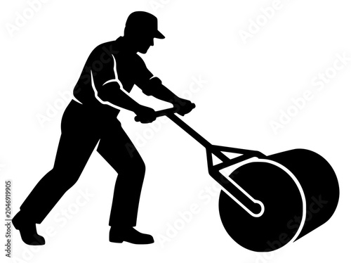 Silhouette of a worker pushing a manual lawn or turf roller