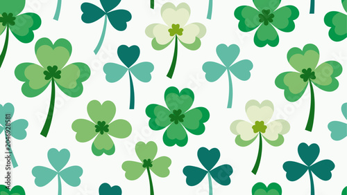 Foto A delicate pattern of green four-leaf clovers on white fabric