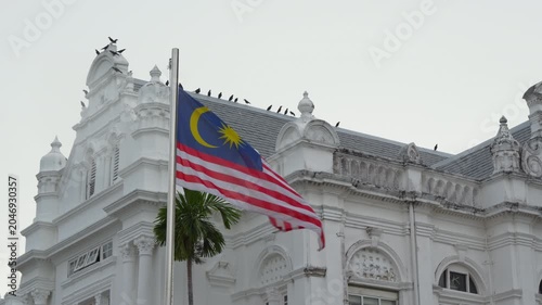 day time penang island george town city hall exterior national flag slow motion panorama 4k malaysia