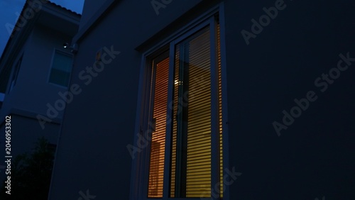 Cuadro en lienzo At dusk, the home glows with warm light, symbolizing daily household electricity consumption and the ongoing reliance on energy to provide comfort, safety, and convenience during evening hours