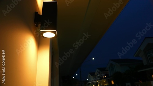 Canvastavla Illuminated houses at twilight often indicate unnecessary energy consumption, showcasing the comfort and ease that middle-class families enjoy, sometimes leading to wasted electricity
