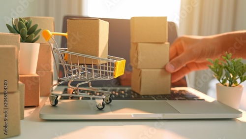 фотографія A hand stacking boxes in layers reflects bulk purchasing from e-commerce, emphasizing digital shopping trends, efficient logistics, consumer demand, and online business growth