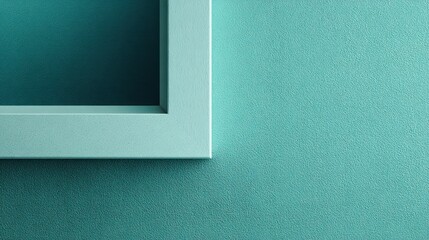 Corner of a smooth architectural molding section set against a textured cyan background