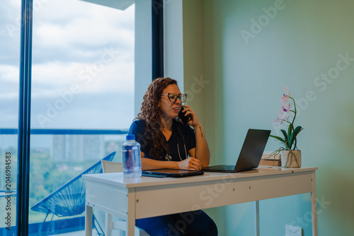 Obraz na plátně Healthcare professional providing telecare at home office