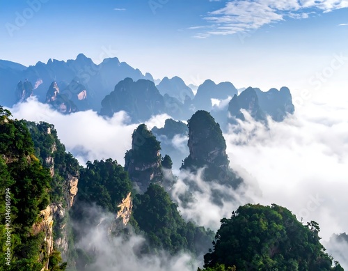 A mountain range with dense fog rolling through