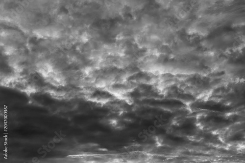 Photos Black and white cloudscape with turbulent dark formations filling the frame