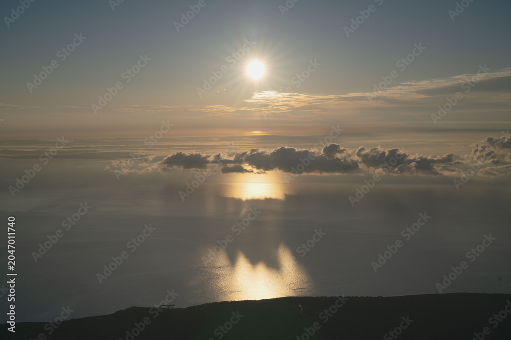 Fototapeta premium Hokkaido, sea of clouds and mountain peak, with morning glow, in september, scenery