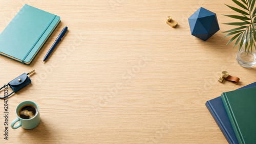 Wooden desk workspace notebook pen coffee clipboard Minimal flat lay wooden desk workspace with notebook, pen, coffee, clipboard, geometric decor
