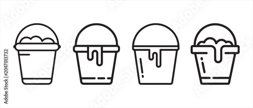 Photos Set of bucket icons with liquid spilling out in a minimalist black and white line art style