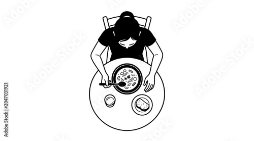 Woman eating at a table alone.