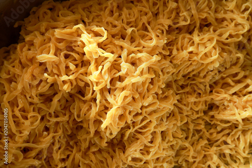 Foto Appetizing close up background showing golden dried shredded squid seafood snack