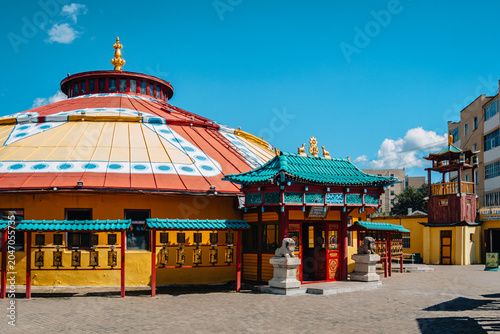 Colorful ger-shaped Buddhist temple and prayer wheels at Dashchoilin Monastery in central Ulaanbaatar, Mongolia.