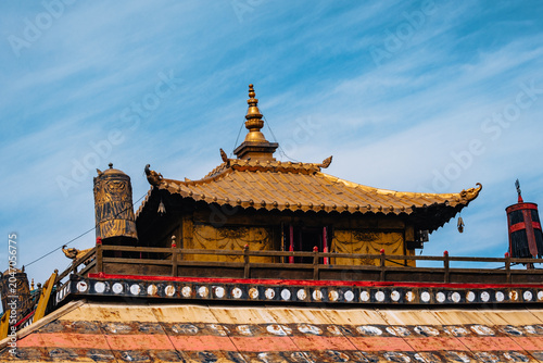 Golden rooftop of Gandantegchinlen Monastery in Ulaanbaatar, Mongolia, showcasing traditional Buddhist architecture.