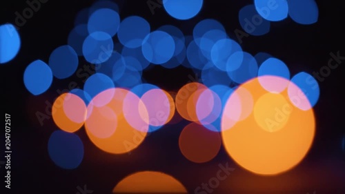 Soft defocused blurred blue and orange lights bokeh background blur light abstract night glow