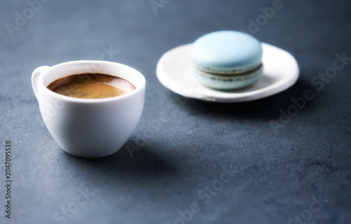Cup of coffee on a dark stone background. Soft focus. Copy space
