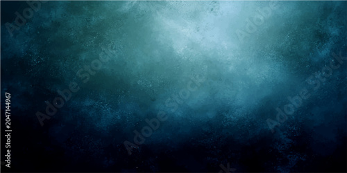 Fotografie Abstract blue and teal textured background with soft light.