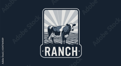 Vintage style dairy cow standing in a field with sun rays.