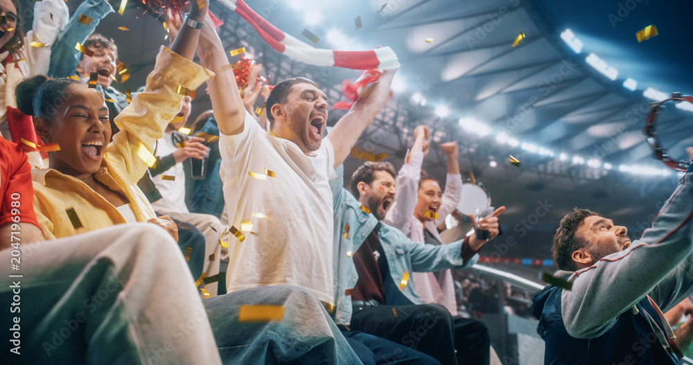Naklejka premium Portrait of Black Female and White Male Soccer Football Fans in Stadium Stands During Championship Match, Raising Scarves as Confetti Falls, Happy, Smiling, Excited, Lifting Scarves to Cheer.