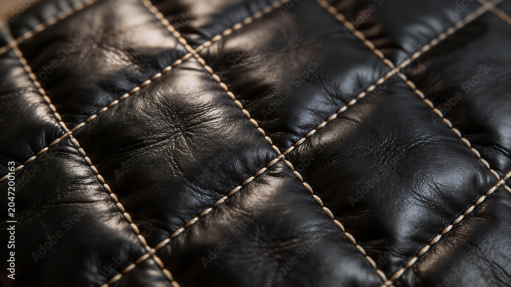 Fototapeta premium Closeup of quilted black leather symbolizing the limitless potential of digital design
