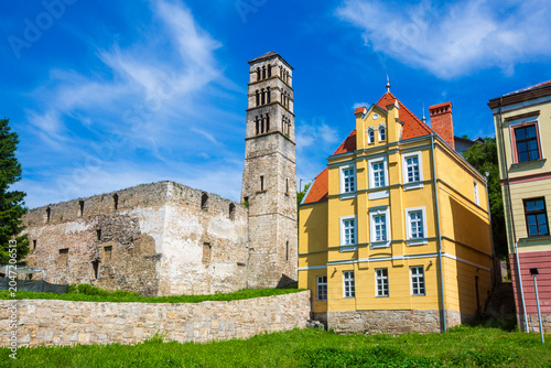 Quadro su tela Historical St Luke bell tower and medieval church ruins next to a colorful vinta