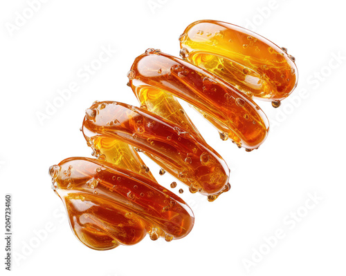 Viscous Amber Liquid: A mesmerizing, viscous amber liquid, resembling honey or syrup, cascades in a beautiful, flowing pattern, glistening under studio lights.