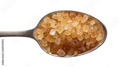 Quadro su tela Metal spoon filled with brown sugar crystals, isolated on transparent background