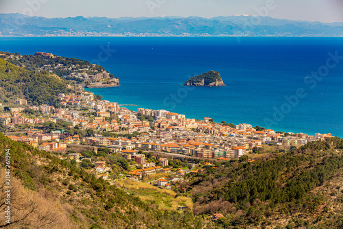 Aerial panoramic view of the coast of Spotorno, Bergeggi Island, Torre del Mare, Liguria, province of Savona, Italy. Riviera dei Fiori. Western Riviera. Ligurian Sea