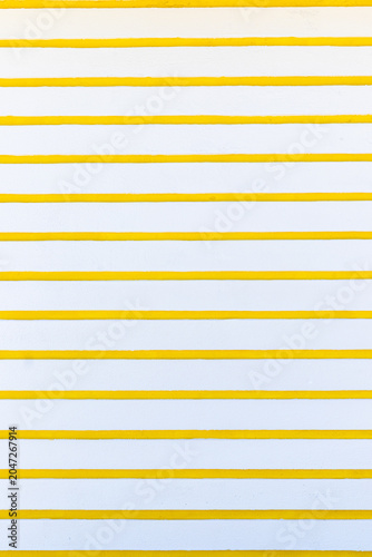 White and yellow striped wall background