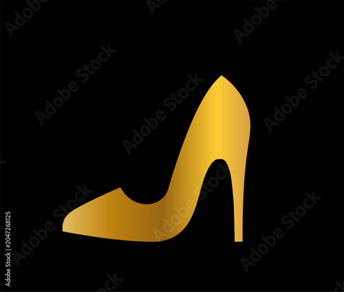 the shoe is gold on a black background,