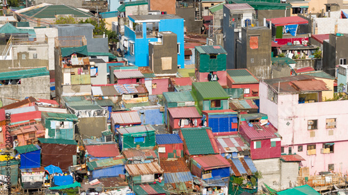 Aerial view of densely packed colorful houses and makeshift structures in an informal urban settlement Manila, Metro Manila, Philippines.
