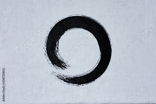 Minimalist zen enso circle brush stroke on white canvas
