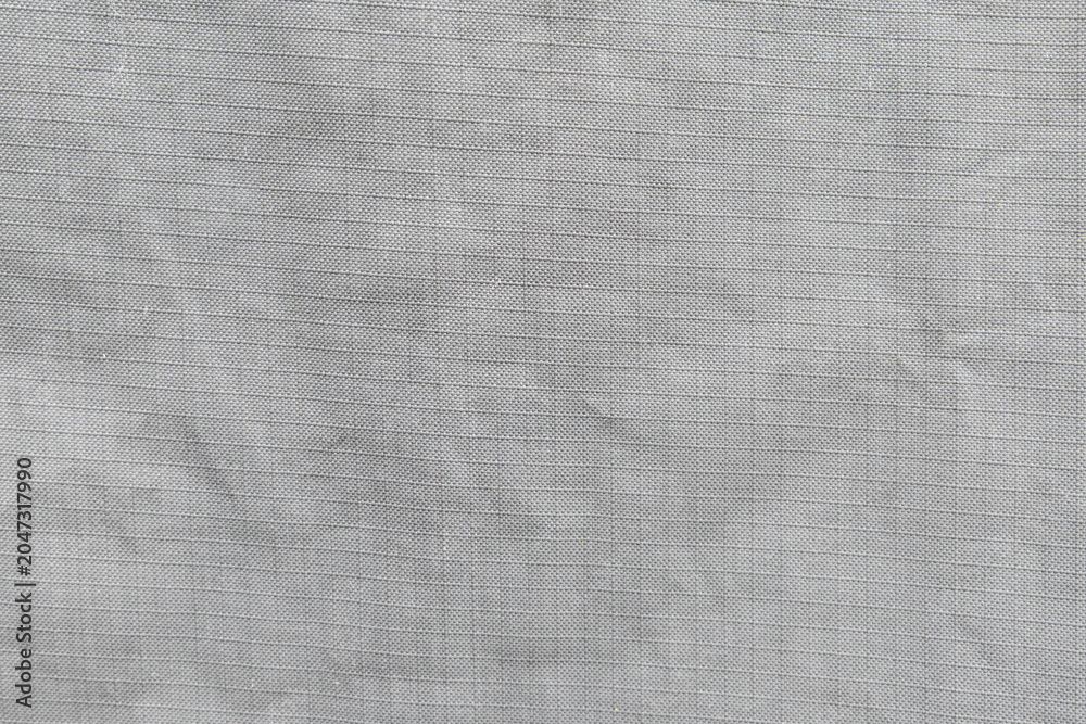 Fototapeta premium Grey Fabric Ripstop Texture – Symbol and Background Structure for Textile Industry, Manufacturing, Material Costs