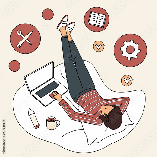 Young woman working on a laptop while relaxing at home with productivity