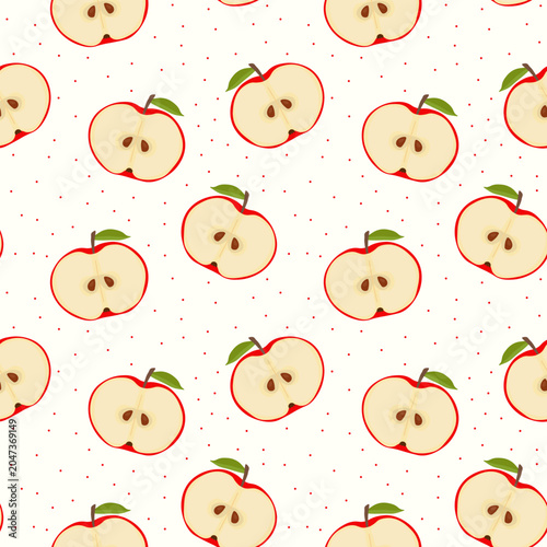 Apple halves seamless pattern featuring red fruit slices with green leaves and tiny polka dots on white background used for kitchen textiles wrapping paper and nursery wallpaper decor