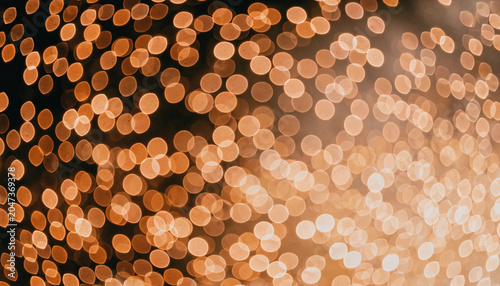 Schilderij op canvas Golden bokeh lights abstract background with soft glowing particles on transpare