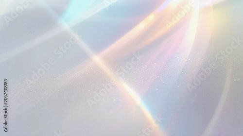 Elegant soft abstract background featuring ethereal light streaks and prismatic lens flares on a subtle textured surface, perfect for modern digital design, luxury branding, and minimalist wallpaper.