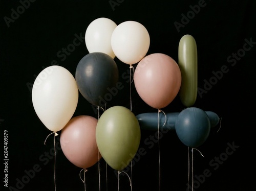Colorful balloons on black background.