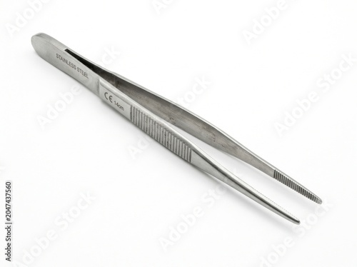 Close-up of metal surgical tweezers.