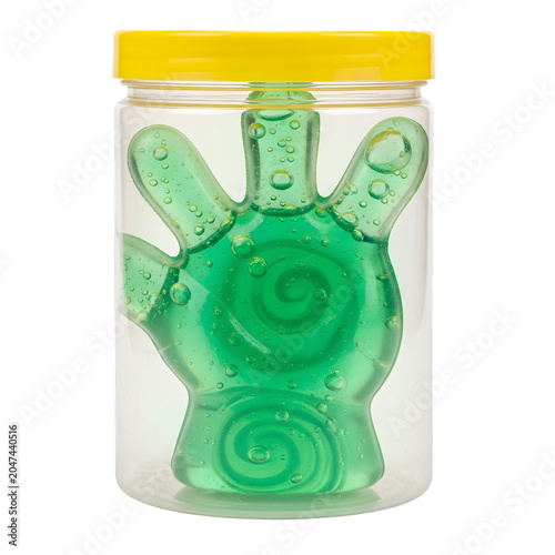 A green hand-shaped stress reliever toy in a clear plastic jar with a yellow lid Photo realistic image. png