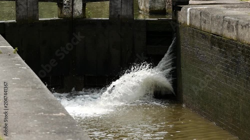 a lock gate on a canal on the inland waterways network of navigable canals and waterways in the english and british countryside in the uk, united kingdom, great britain, europe
