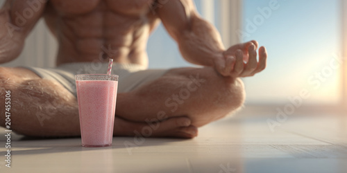 Muscular man meditating with smoothie, healthy lifestyle, fitness, wellness, relaxation, mindfulness, morning light