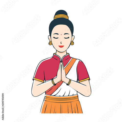 Woman in traditional attire with hands pressed together in greeting