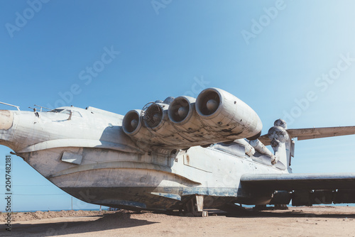 Photography Large Soviet-era ekranoplan wing-in-ground effect craft parked on a sandy coasta